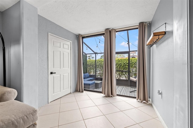 1986 Pelican Landing Blvd Unit 1514, Clearwater, FL 33762 - living area featuring a wall of windows, a textured wall, baseboards, and a textured ceiling