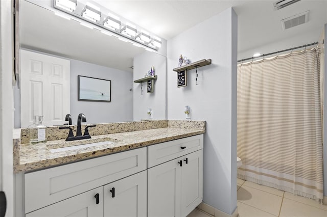1986 Pelican Landing Blvd Unit 1514, Clearwater, FL 33762 - bathroom featuring tile patterned flooring, toilet, vanity, and visible vents