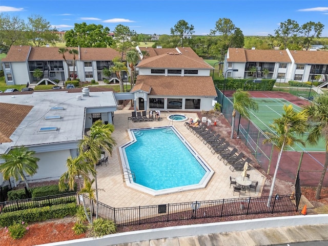 1986 Pelican Landing Blvd Unit 1514, Clearwater, FL 33762 - pool with a patio area, a residential view, a hot tub, and fence