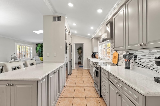 kitchen featuring light tile patterned floors, visible vents, appliances with stainless steel finishes, and gray cabinetry