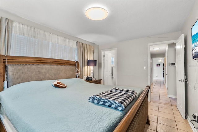 bedroom featuring light tile patterned flooring