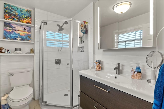 full bath featuring backsplash, toilet, a stall shower, and vanity