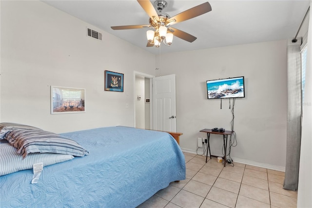 bedroom featuring light tile patterned floors, baseboards, visible vents, and ceiling fan