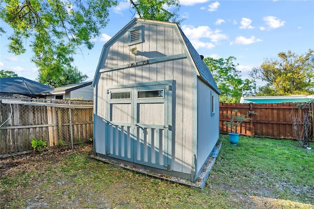 view of shed with a fenced backyard