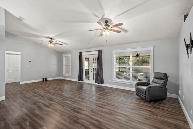 interior space featuring visible vents, dark wood-style flooring, a ceiling fan, and vaulted ceiling