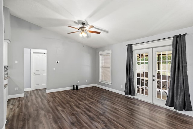 empty room featuring a ceiling fan, dark wood-style floors, french doors, baseboards, and lofted ceiling