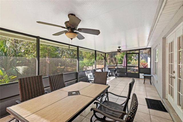 sunroom / solarium with visible vents and ceiling fan