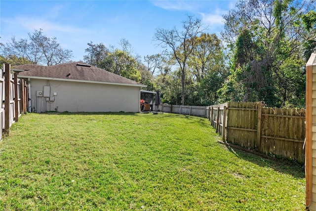 view of yard with a fenced backyard