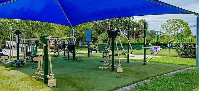surrounding community with playground community and a lawn