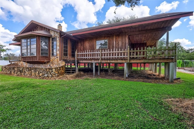 6501 62nd St N, Pinellas Park, FL 33781 - rear view of property with a chimney and a yard