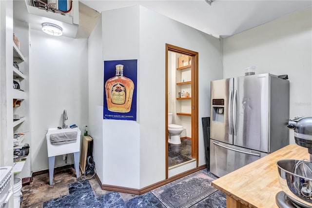 6501 62nd St N, Pinellas Park, FL 33781 - bathroom featuring baseboards and toilet