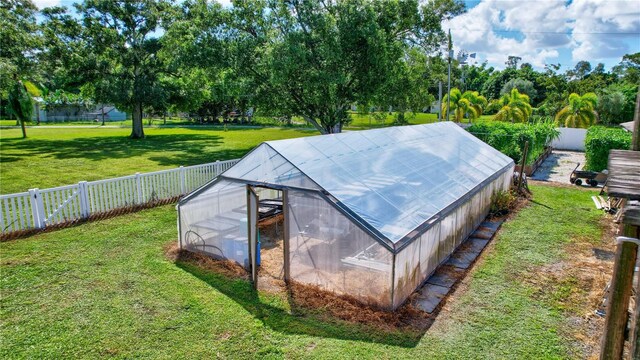 6501 62nd St N, Pinellas Park, FL 33781 - view of greenhouse with a fenced backyard and a lawn