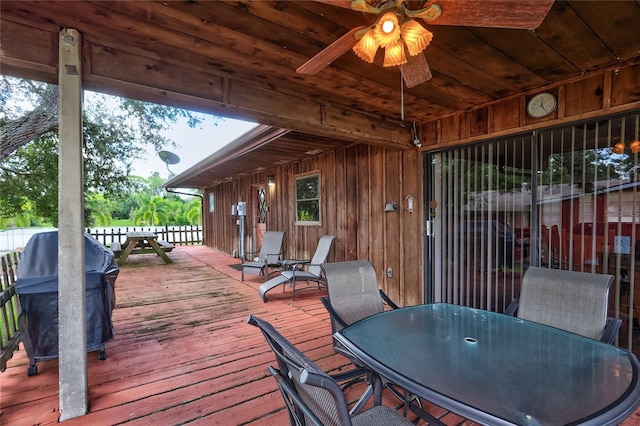 6501 62nd St N, Pinellas Park, FL 33781 - wooden deck with outdoor dining area and a ceiling fan