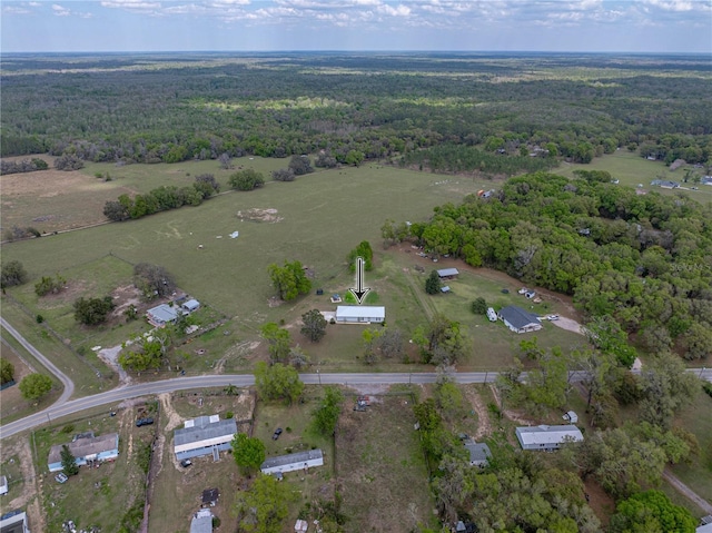 aerial view featuring a wooded view