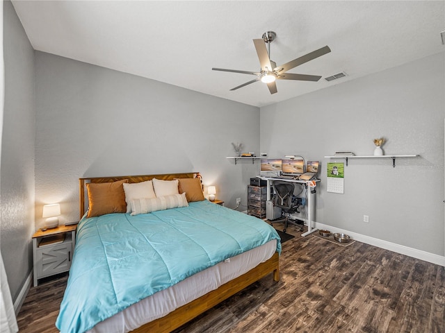 bedroom featuring visible vents, ceiling fan, baseboards, and wood finished floors