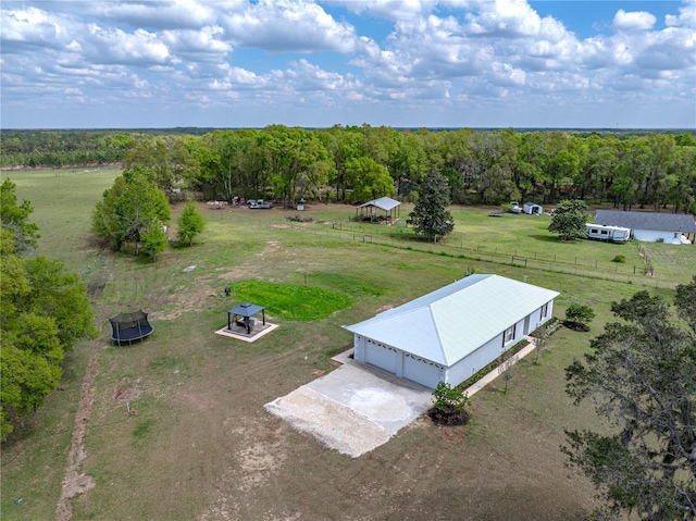drone / aerial view with a rural view and a wooded view