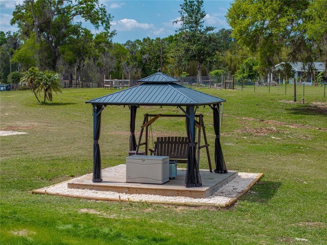 view of community featuring a gazebo and a yard