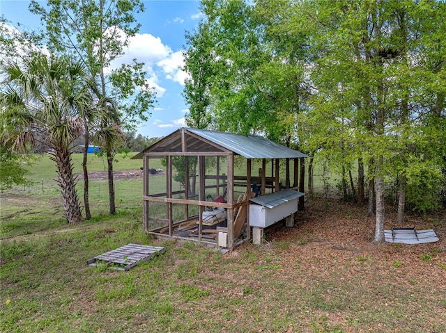 view of yard with an outdoor structure and exterior structure