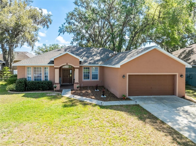 ranch-style home with stucco siding, driveway, a shingled roof, an attached garage, and a front yard