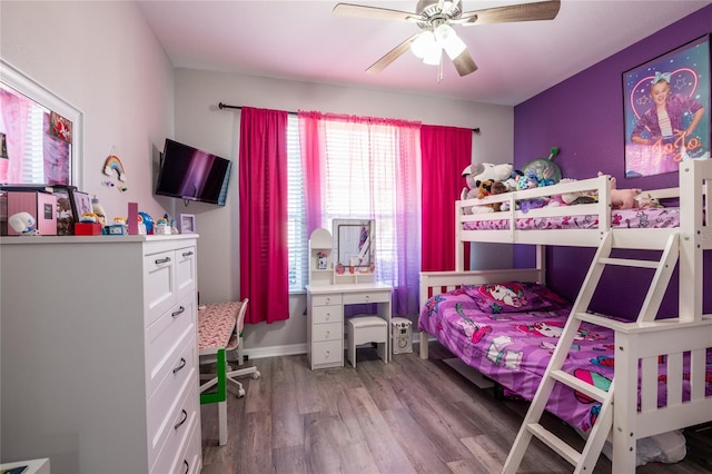 bedroom with light wood-style flooring and a ceiling fan