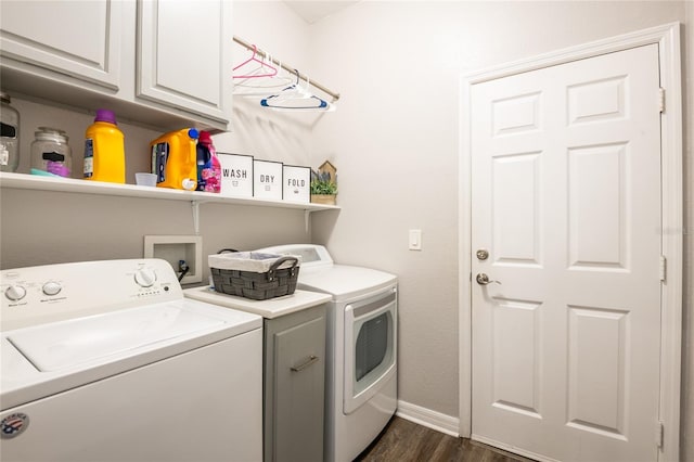 washroom featuring cabinet space, dark wood-style floors, separate washer and dryer, and baseboards