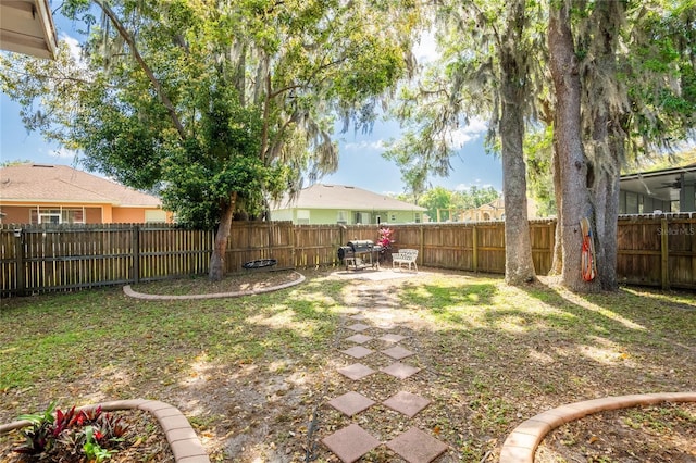 view of yard featuring a fenced backyard and a patio area