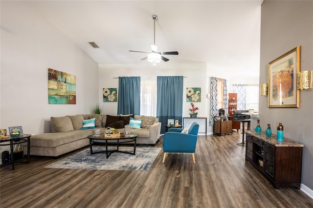 5416 Oxford Manor Cir, Lakeland, FL 33810 - living room with dark wood-style floors, visible vents, ceiling fan, and vaulted ceiling