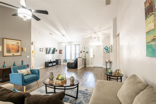5416 Oxford Manor Cir, Lakeland, FL 33810 - living area with wood finished floors, baseboards, visible vents, lofted ceiling, and ceiling fan
