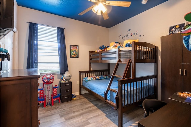 5416 Oxford Manor Cir, Lakeland, FL 33810 - bedroom with wood finished floors, baseboards, and ceiling fan
