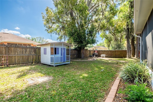 5416 Oxford Manor Cir, Lakeland, FL 33810 - view of yard with a fenced backyard, a storage shed, and an outdoor structure