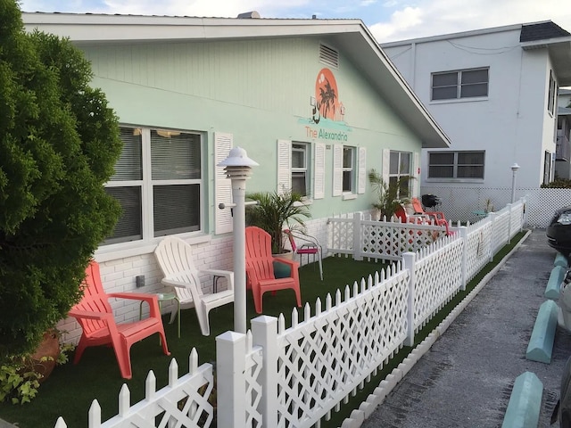 view of front of house featuring fence