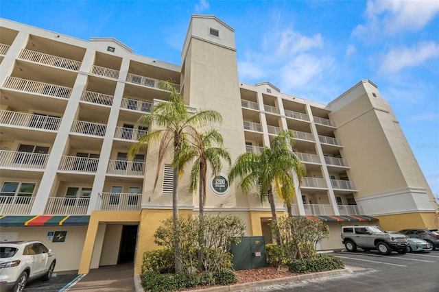 1200 Country Club Dr Unit 3303, Largo, FL 33771 - view of building exterior with uncovered parking