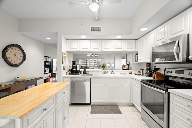1200 Country Club Dr Unit 3303, Largo, FL 33771 - kitchen featuring a ceiling fan, visible vents, recessed lighting, appliances with stainless steel finishes, and a sink