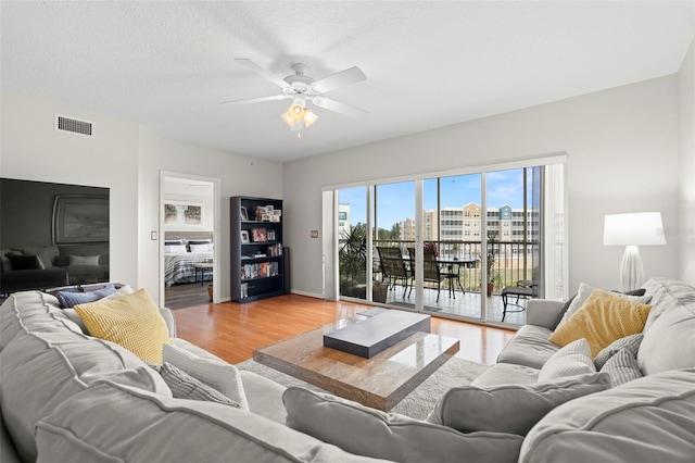 1200 Country Club Dr Unit 3303, Largo, FL 33771 - living room featuring light wood-style floors, visible vents, baseboards, and a ceiling fan