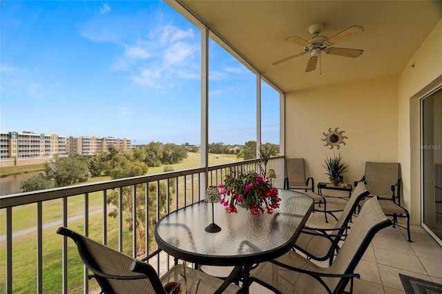 1200 Country Club Dr Unit 3303, Largo, FL 33771 - balcony with ceiling fan and outdoor dining area