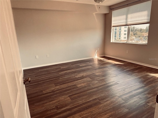1200 Country Club Dr Unit 3303, Largo, FL 33771 - empty room with a ceiling fan, baseboards, and dark wood-style flooring