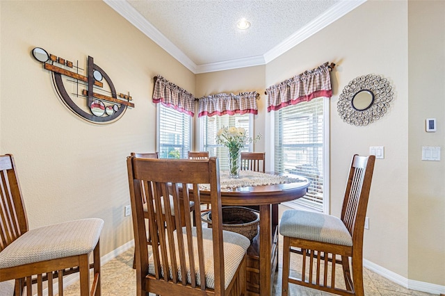 dining space with baseboards, a textured ceiling, and crown molding