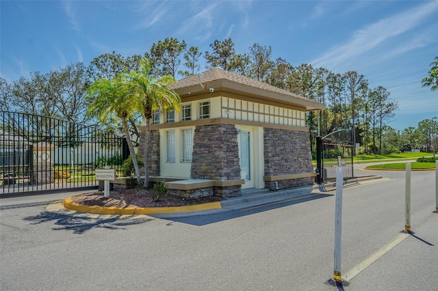 exterior space featuring a gate and fence