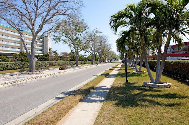 view of road with curbs and sidewalks