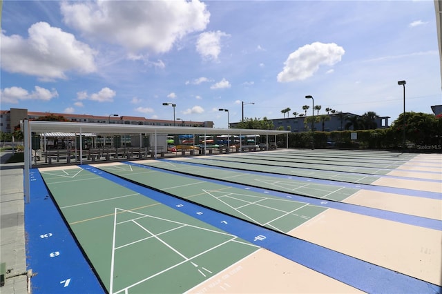 view of property's community featuring shuffleboard