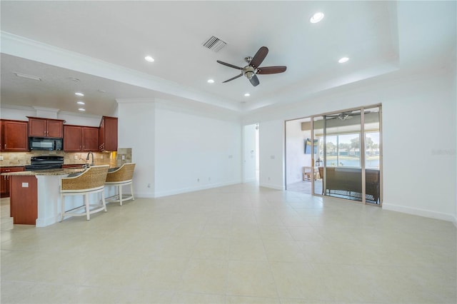2234 Nottingham Greens Dr Unit 2234, Sun City Center, FL 33573 - living room with a tray ceiling, visible vents, recessed lighting, and a ceiling fan
