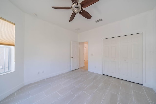 2234 Nottingham Greens Dr Unit 2234, Sun City Center, FL 33573 - unfurnished bedroom featuring a ceiling fan, baseboards, visible vents, and a closet