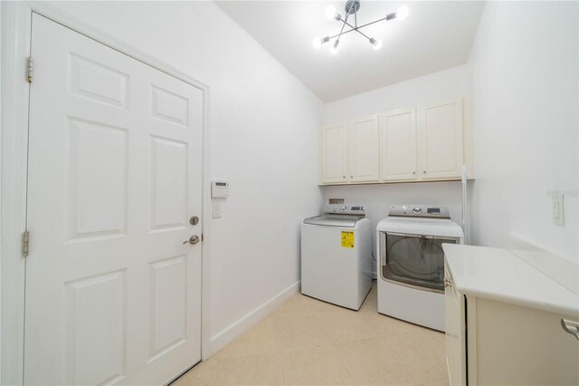 2234 Nottingham Greens Dr Unit 2234, Sun City Center, FL 33573 - laundry room featuring cabinet space, baseboards, independent washer and dryer, and an inviting chandelier