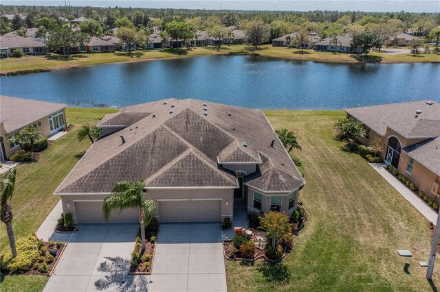 2234 Nottingham Greens Dr Unit 2234, Sun City Center, FL 33573 - bird's eye view featuring a water view and a residential view