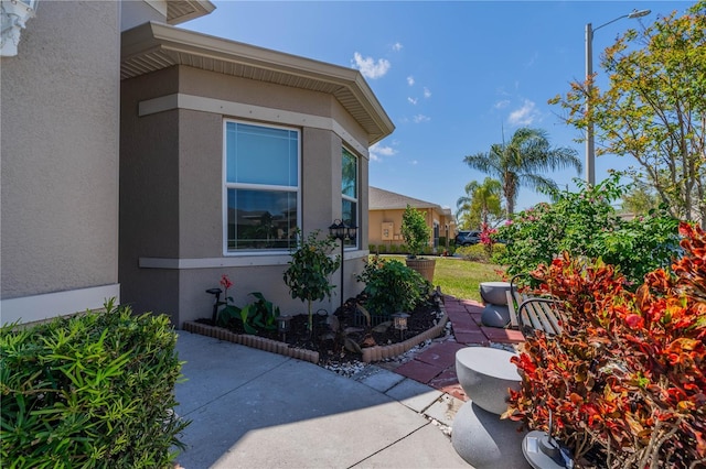 2234 Nottingham Greens Dr Unit 2234, Sun City Center, FL 33573 - view of property exterior featuring stucco siding