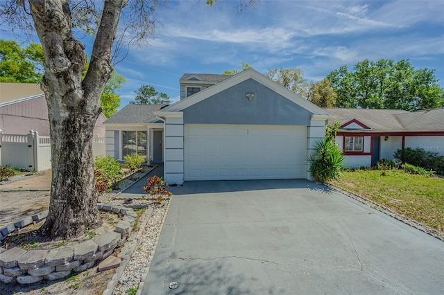 single story home with fence, a garage, driveway, and stucco siding