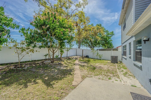 view of yard with cooling unit and a fenced backyard