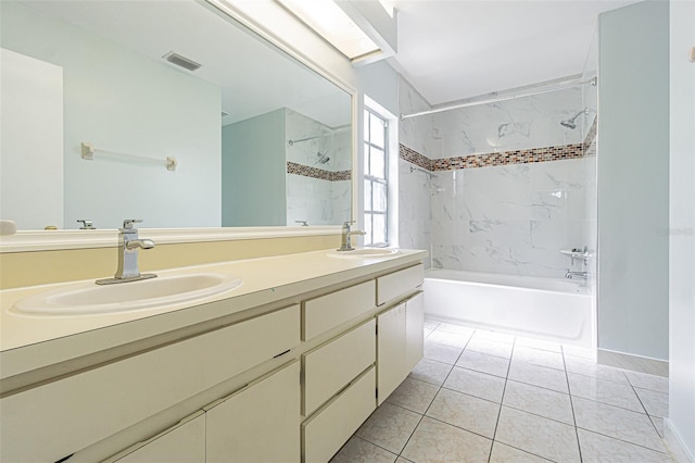 bathroom with tile patterned flooring, shower / bathing tub combination, double vanity, and a sink