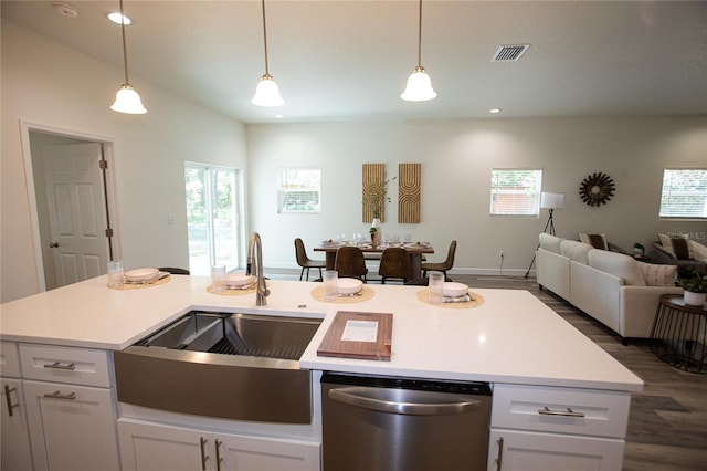 9445 Eldridge Rd, Spring Hill, FL 34608 - kitchen featuring dishwasher, dark wood-style floors, open floor plan, light countertops, and healthy amount of natural light