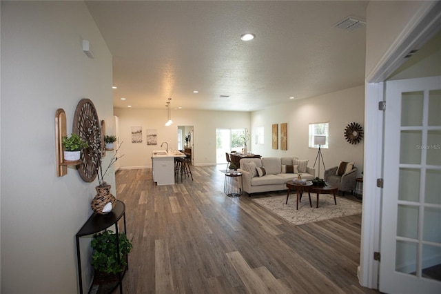 9445 Eldridge Rd, Spring Hill, FL 34608 - living area featuring dark wood-style floors and recessed lighting